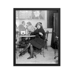 Lady with a hidden flask - a woman pours a drink from a flask hidden inside a cane during the Prohibition era, 1922 framed print on a plain backdrop in size 16"x20".