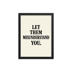 Let them misunderstand you framed print on a plain backdrop in size 12"x16".