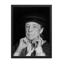Louise Bourgeois framed print on a plain backdrop in size 18"x24".