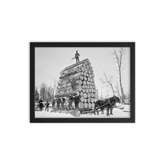 Lumberjacks at work - a team of lumberjacks posing with a giant load of logs they are moving with a sled, Michigan, 1890 framed print on a plain backdrop in size 12"x16".