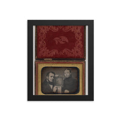 Man and Woman Posing with Family Daguerreotype, c. 1850 framed print on a plain backdrop in size 8"x10".