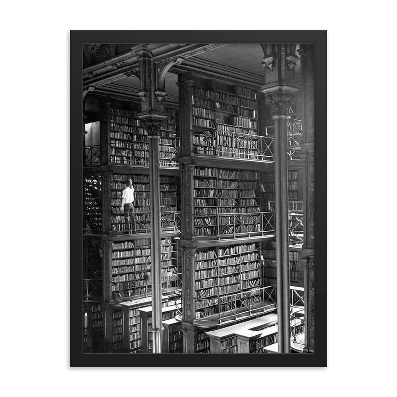 Man Browsing for Books in the Old Public Library of Cincinnati framed print on a plain backdrop in size 18