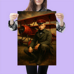 Manfred von Richthofen seated beside crimson triplane poster 3