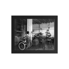 Mechanics at an auto repair shop replacing an engine in an early model car - Washington, DC, 1920 framed print on a plain backdrop in size 8"x10".