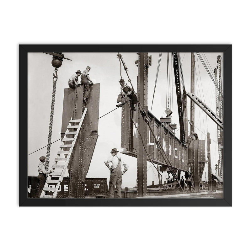New York City steelworkers - vintage photograph of Steelworkers on the Consolidated Gas Company building maneuvering a large girder into place, New York, 1913 framed print on a plain backdrop in size 18