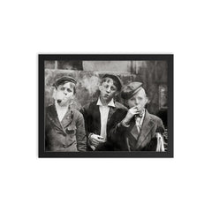 Newsies (newspaper boys) pose for a portrait while smoking - St Louis, Missouri, 1910 framed print on a plain backdrop in size 12"x16".