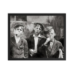 Newsies (newspaper boys) pose for a portrait while smoking - St Louis, Missouri, 1910 framed print on a plain backdrop in size 16"x20".