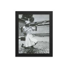 Nurse with an M-3 Grease Gun, WWII 1940s framed print on a plain backdrop in size 8"x10".