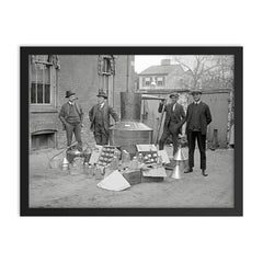 Prohibition Agents pose with a large still and equipment seized from a moonshine operation, Washington, DC 1922 framed print on a plain backdrop in size 18"x24".