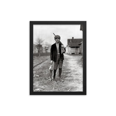Rabbit Hunting - A boy returns home from rabbit hunting, Dillon, South Carolina, 1909 framed print on a plain backdrop in size 12"x16".
