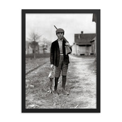 Rabbit Hunting - A boy returns home from rabbit hunting, Dillon, South Carolina, 1909 framed print on a plain backdrop in size 18"x24".