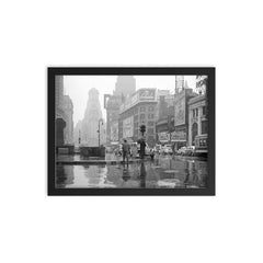 Rainy Day in Times Square - A view of Times Square on a rainy day, New York City, 1943 framed print on a plain backdrop in size 12"x16".