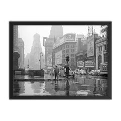 Rainy Day in Times Square - A view of Times Square on a rainy day, New York City, 1943 framed print on a plain backdrop in size 18"x24".