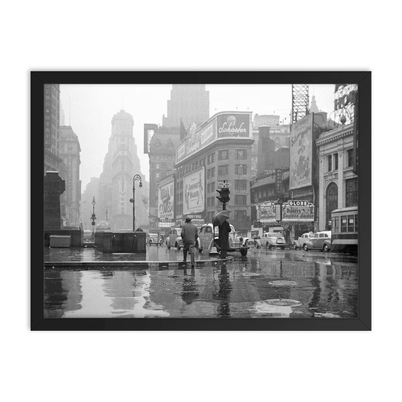 Rainy Day in Times Square - A view of Times Square on a rainy day, New York City, 1943 framed print on a plain backdrop in size 18