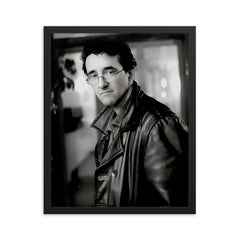 Roberto Bolano framed print on a plain backdrop in size 16"x20".