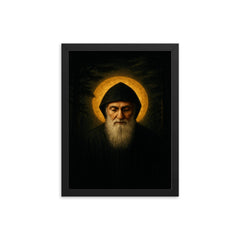 Saint Charbel in cedar darkness and gold light framed print on a plain backdrop in size 12"x16".