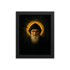 Saint Charbel in cedar darkness and gold light framed print on a plain backdrop in size 8"x10".