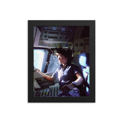 Sally Ride on the Flight Deck, 1983 framed print on a plain backdrop in size 8"x10".