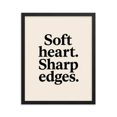 Soft heart Sharp edges framed print on a plain backdrop in size 16"x20".