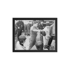 South Korean Soldier Cutting Hair During 1970s Crackdown framed print on a plain backdrop in size 12"x16".