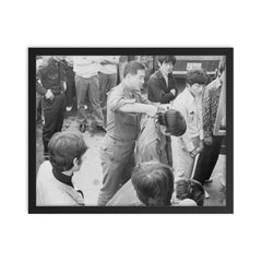 South Korean Soldier Cutting Hair During 1970s Crackdown framed print on a plain backdrop in size 16"x20".