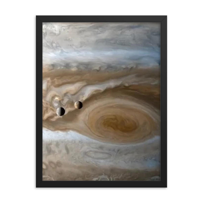 The moons Io and Europe passing by Jupiter, captured by Cassini framed print on a plain backdrop in size 18