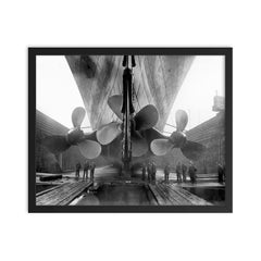 The RMS Titanic in dry dock at the Harland and Wolff shipyard in Belfast, Ireland, 1910 framed print on a plain backdrop in size 16"x20".