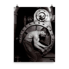 The Steamfitter, 1921 - Lewis Hines' iconic black and white photo of a power plant mechanic posed in front of a steam generator poster on a plain backdrop in size 8"x10".
