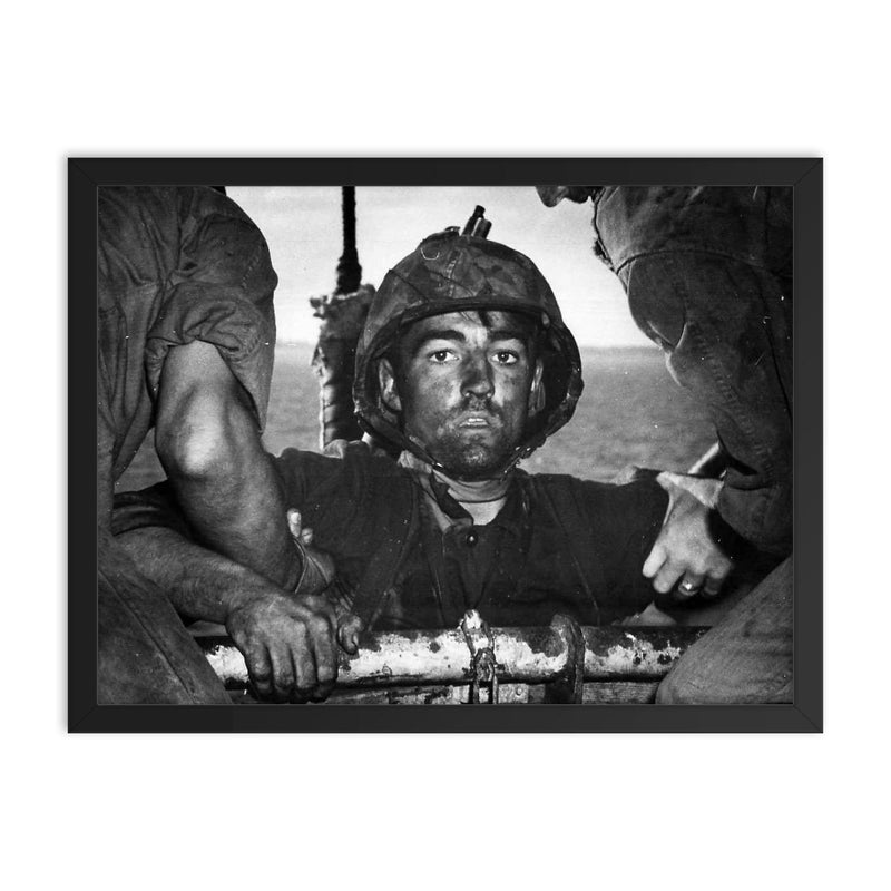The Thousand Yard Stare - US Marine Theodore J  Miller, 1944 framed print on a plain backdrop in size 18