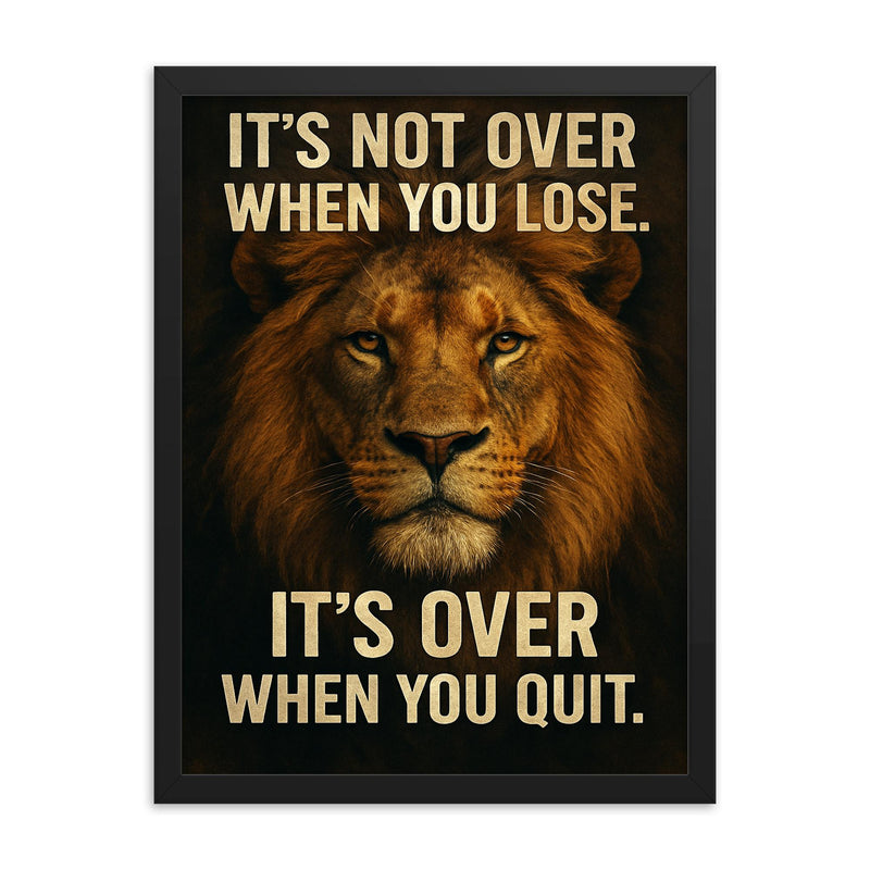 The words 'It's not over when you lose It's over when you quit ' with the face of a majestic looking lion inspirational art framed print on a plain backdrop in size 18