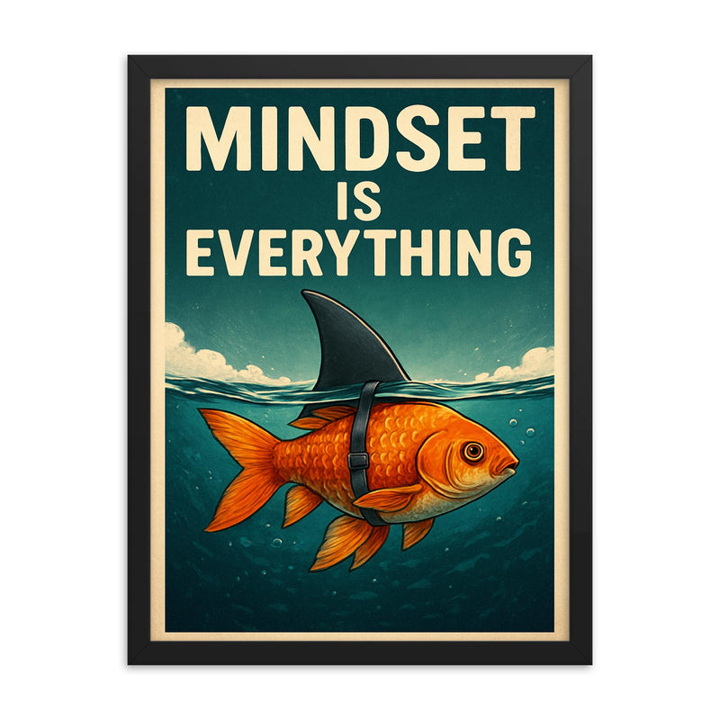 The words 'Mindset is everything' with an image of a goldfish with a shark fin strapped to its back so from above the water it looks like a shark but below the water you can see it's a goldfish framed print on a plain backdrop in size 18
