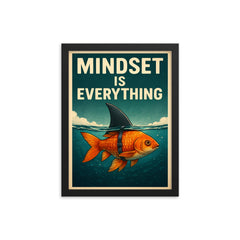 The words 'Mindset is everything' with an image of a goldfish with a shark fin strapped to its back so from above the water it looks like a shark but below the water you can see it's a goldfish framed print on a plain backdrop in size 12"x16".