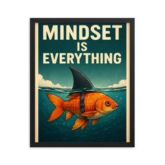 The words 'Mindset is everything' with an image of a goldfish with a shark fin strapped to its back so from above the water it looks like a shark but below the water you can see it's a goldfish framed print on a plain backdrop in size 16"x20".