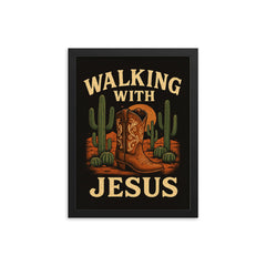 The words 'Walking with Jesus' with a cowgirl aesthetic inspired design of desert cacti and cowgirl boots framed print on a plain backdrop in size 12"x16".