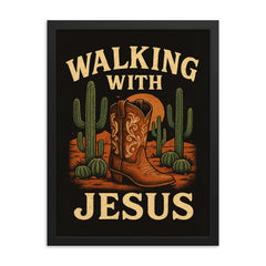The words 'Walking with Jesus' with a cowgirl aesthetic inspired design of desert cacti and cowgirl boots framed print on a plain backdrop in size 18"x24".