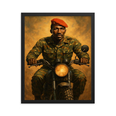 Thomas Sankara on motorcycle with red beret framed print on a plain backdrop in size 16"x20".