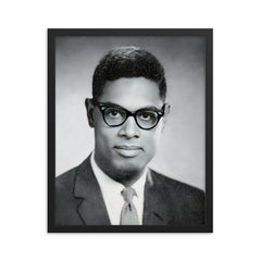 Thomas Sowell framed print on a plain backdrop in size 16"x20".