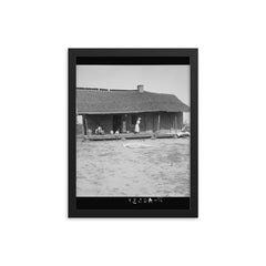 Tobacco sharecroppers home near Tifton, Georgia by Dorothea Lange framed print on a plain backdrop in size 12"x16".