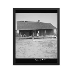 Tobacco sharecroppers home near Tifton, Georgia by Dorothea Lange framed print on a plain backdrop in size 16"x20".