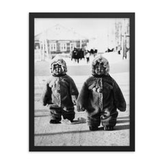Twins Toddlers Dressed for Cold on a Russian Street, 1968 framed print on a plain backdrop in size 18"x24".