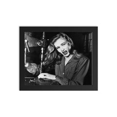 Veronica Lake Demonstrating the Risks of Long Hair for Women War Workers, November 9, 1943 framed print on a plain backdrop in size 8"x10".