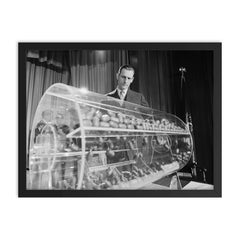 Vietnam Draft Lottery Capsules, Washington D C  1969 framed print on a plain backdrop in size 18"x24".