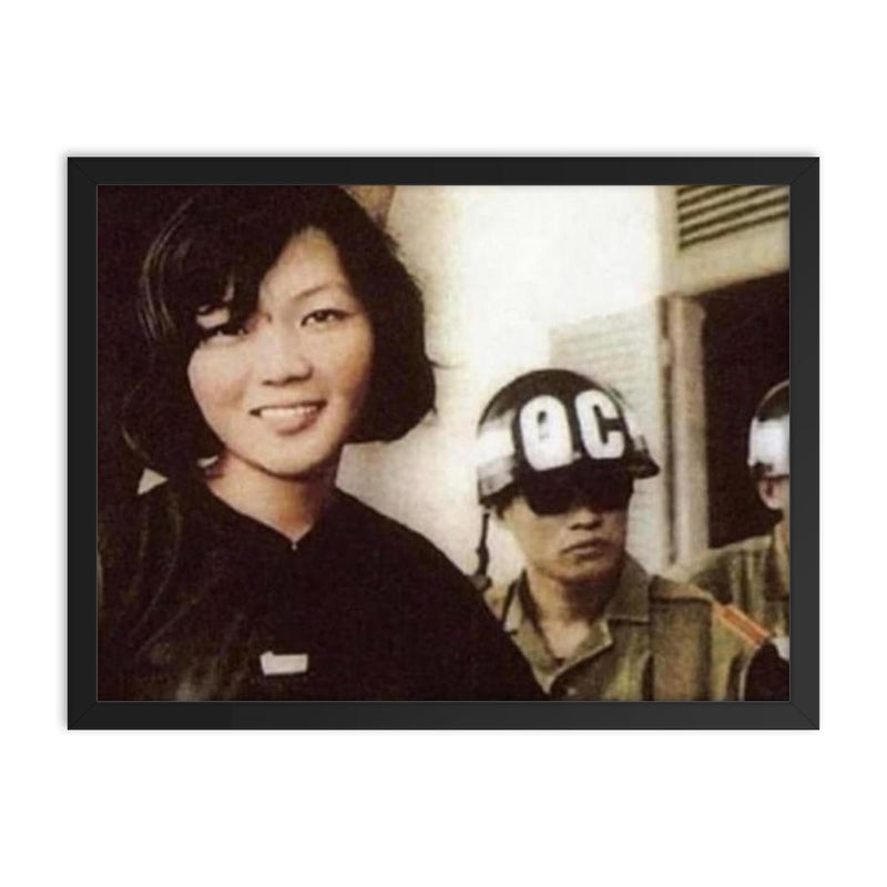 Vo Thi Thang Smiling After Sentencing by South Vietnamese Government, 1968 framed print on a plain backdrop in size 18