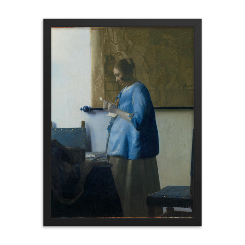 Woman Reading a Letter by Johannes Vermeer framed print on a plain backdrop in size 18