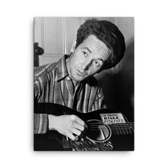 Woody Guthrie canvas print on a plain backdrop in size 18"x24".