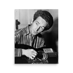 Woody Guthrie poster on a plain backdrop in size 16"x20".