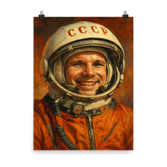 Yuri Gagarin smiling beneath Soviet space helmet poster on a plain backdrop in size 8"x10".