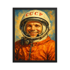 Yuri Gagarin smiling in cosmonaut orange framed print on a plain backdrop in size 16"x20".