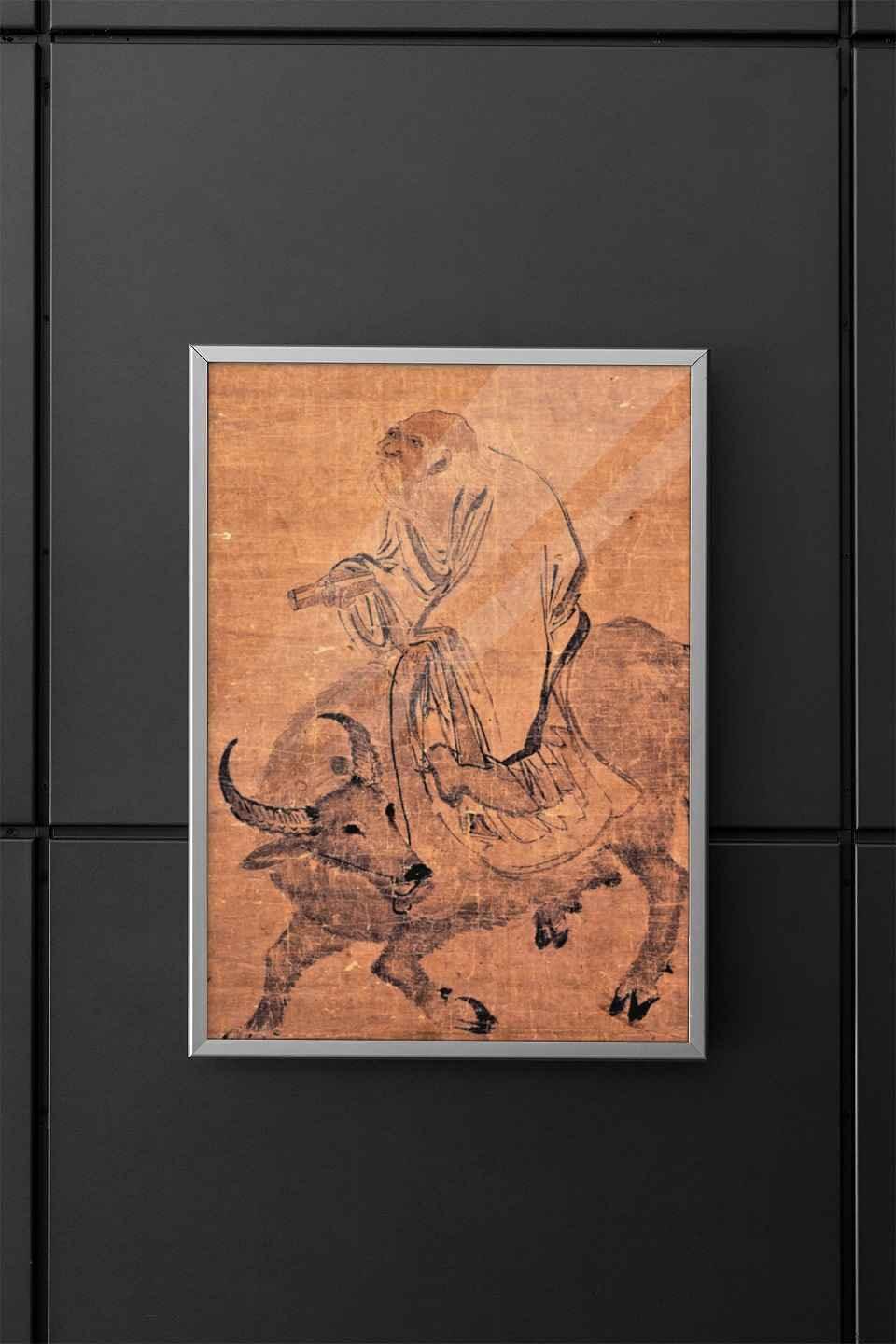 Poster case containing a Lao Tzu poster] mounted on a modern wall.