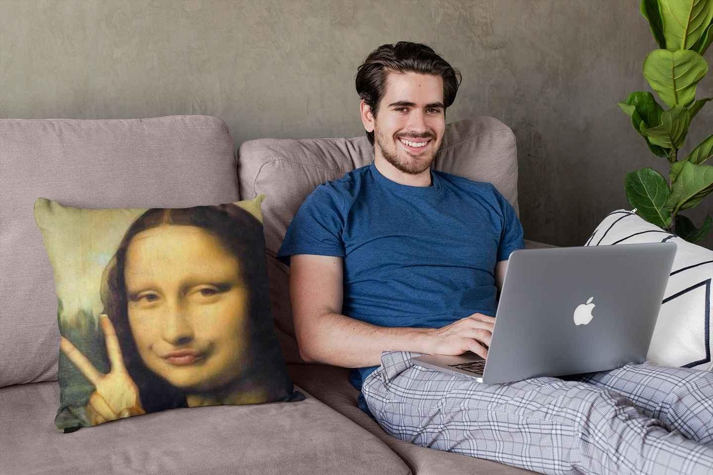 A smiling young man with a laptop sitting next to a Mona Lisa meme.